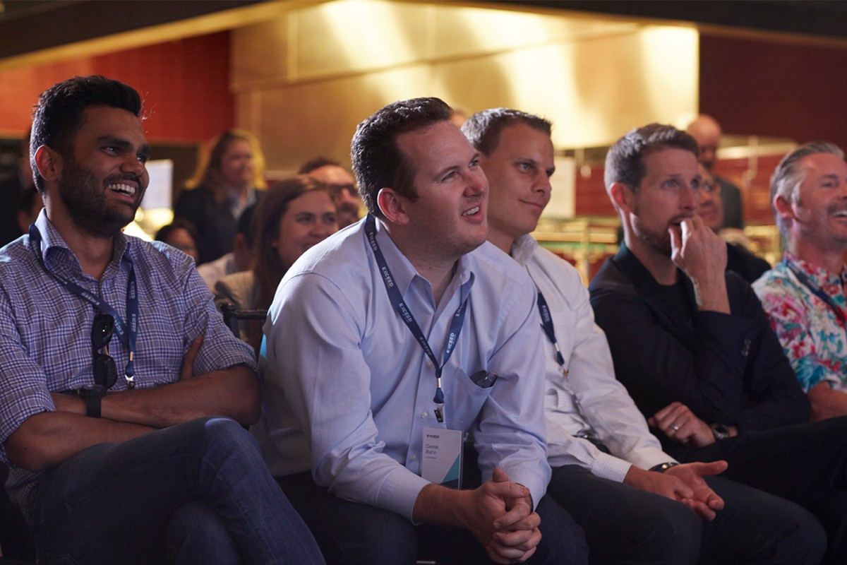 Photograph of the audience watching a presentation at the EXCEED conference