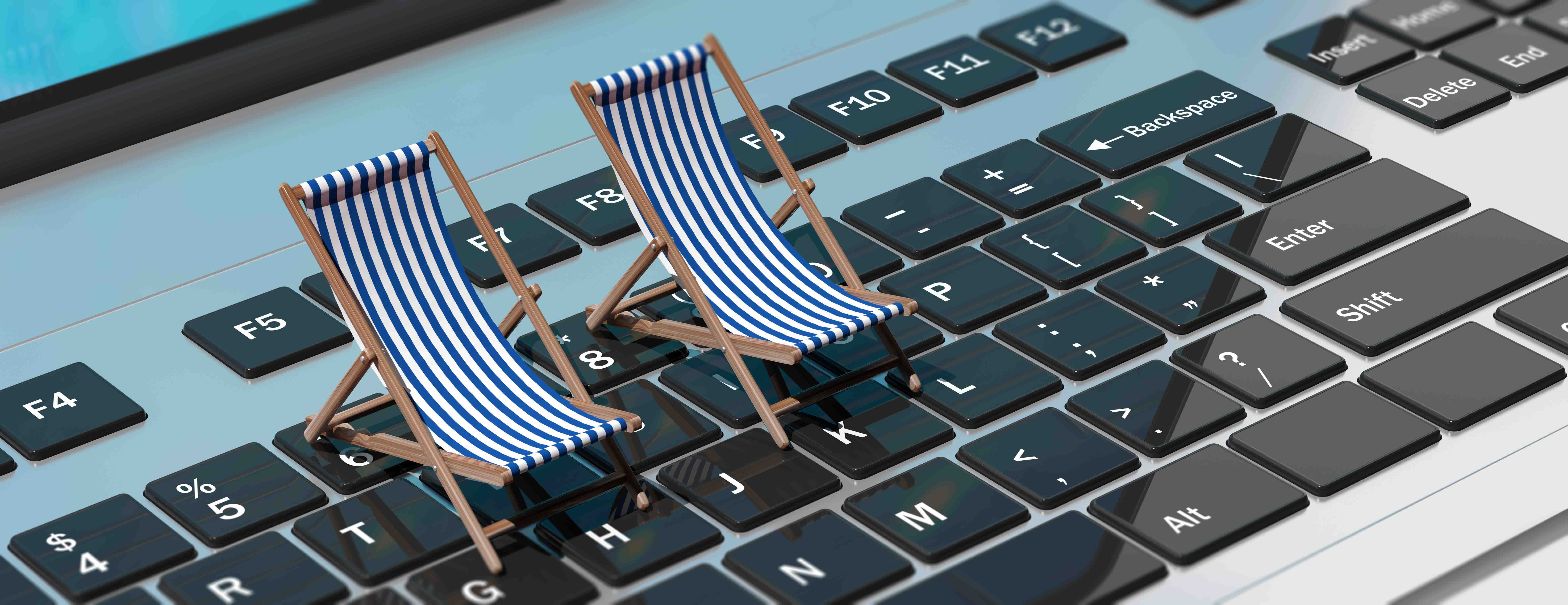 Stylized image of two striped beach chairs on top of a giant laptop keyboard