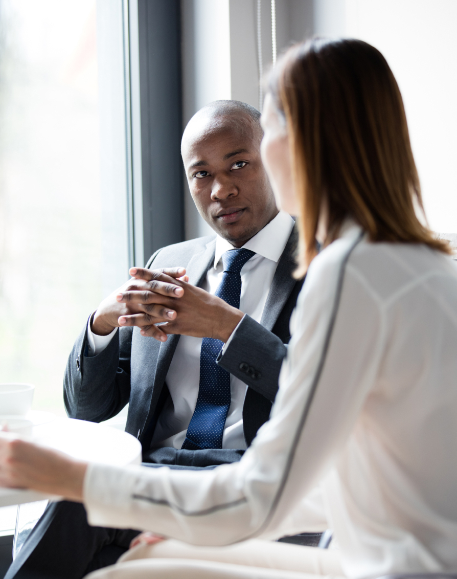 Two business leaders discussing revenue operations