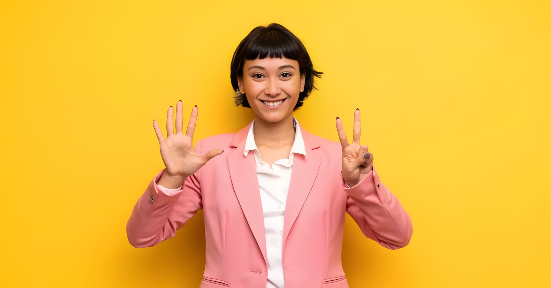 Photograph of a revenue leader holding up seven fingers