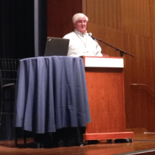 Photograph of Ron Conway speaking at a podium