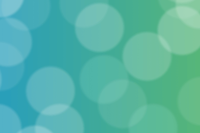 Stylistic image of blurred translucent circles overlapping a blue and green gradient