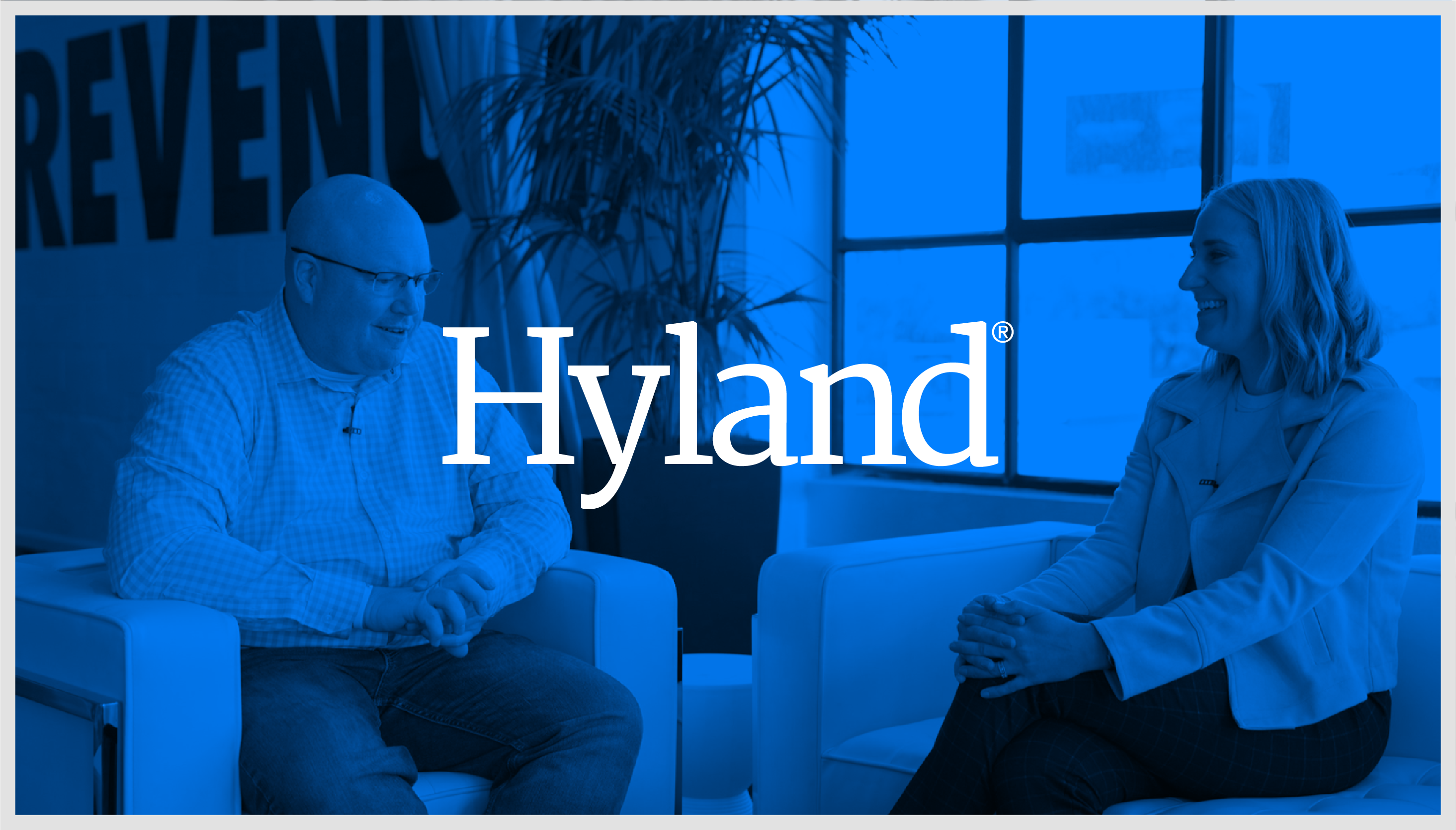 Hyland logo overlapping a photograph of Ed McQuinston, EVP, Chief Commercial Officer at Hyland, and Laura Wille, Director of Customer Marketing at Clari