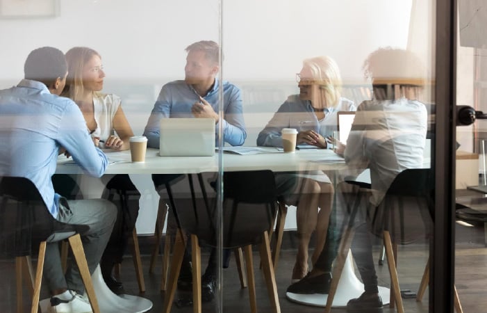 Photograph of a finance team meeting in a conference room