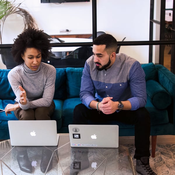 Photograph of two marketing professionals on a video call